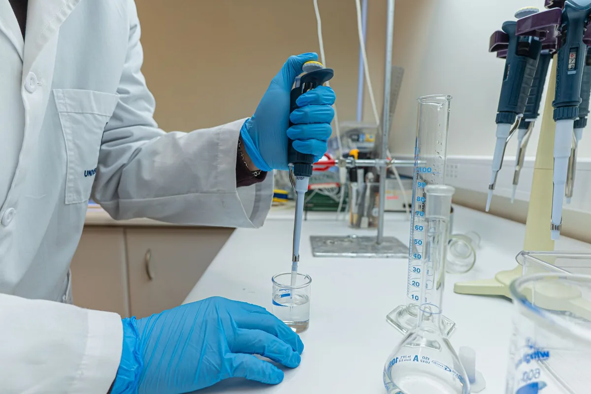 Scientist pipetting a sample in the laboratory